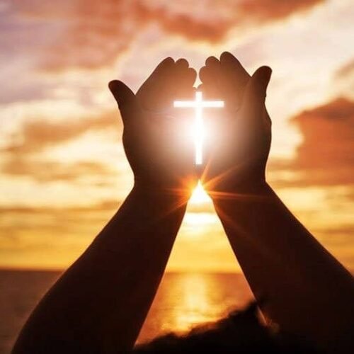 Bhajan Sangrah Song 244 My Bible Song 2026 Praying hands holding a glowing cross at sunset, Christian faith, worship, prayer, spirituality, hope, religious devotion, sunset background, My Bible Song, Christian music, gospel song, praise and worship, religious inspiration.