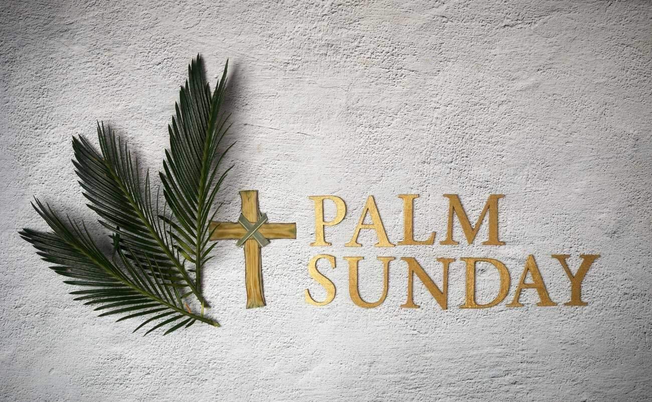 Palm Sunday church decoration with cross and palm leaves, celebrating Christian Holy Week. Perfect for religious events, church services, and Christian education about Palm Sunday significance.