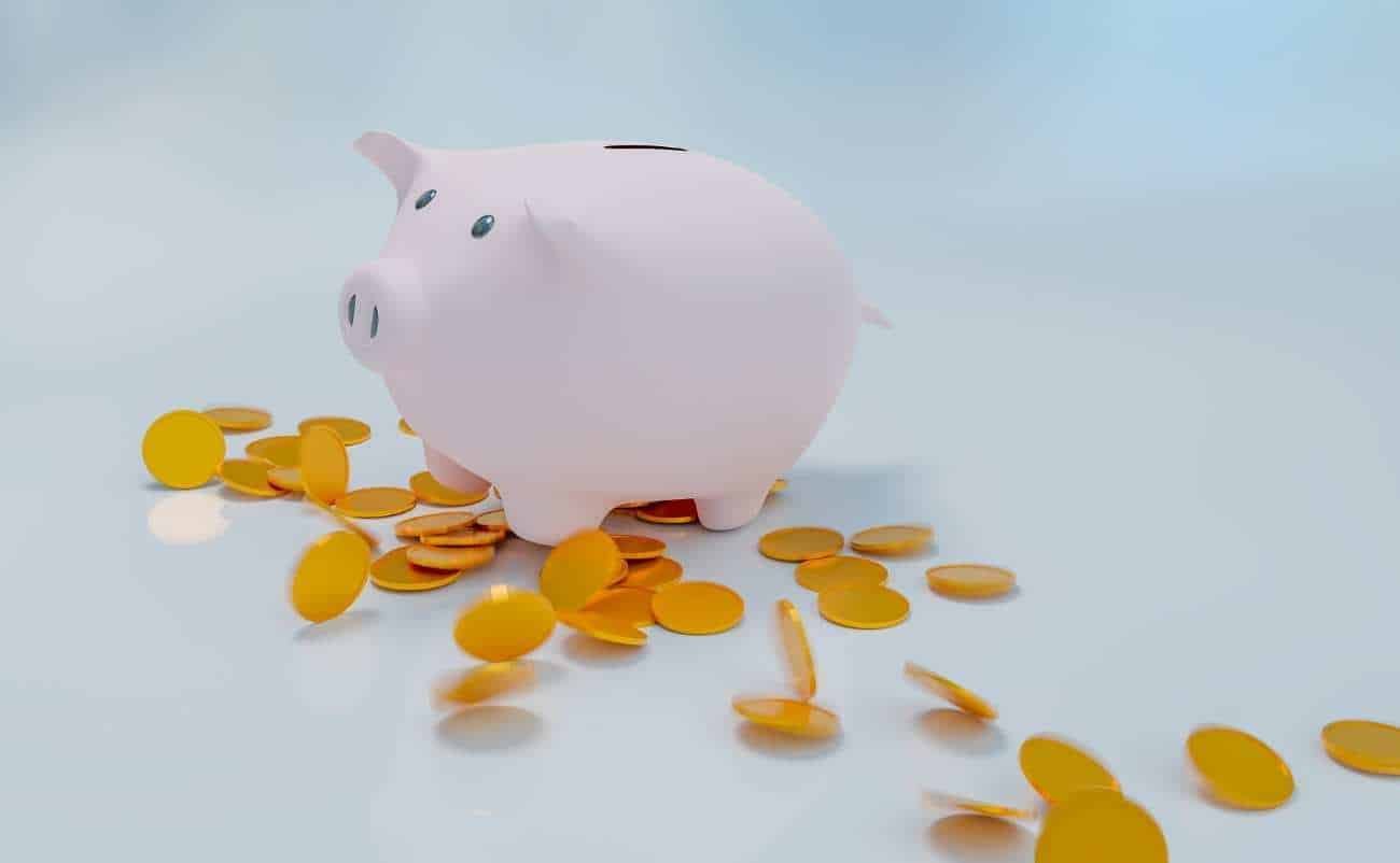 Piggy bank with coins, representing savings and financial growth, reflecting faith-based financial stewardship through My Bible Song.