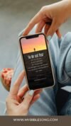 Inspirational Bible verse on phone screen promoting faith and trust in God, ideal for Christian users seeking online biblical encouragement and spiritual songs.