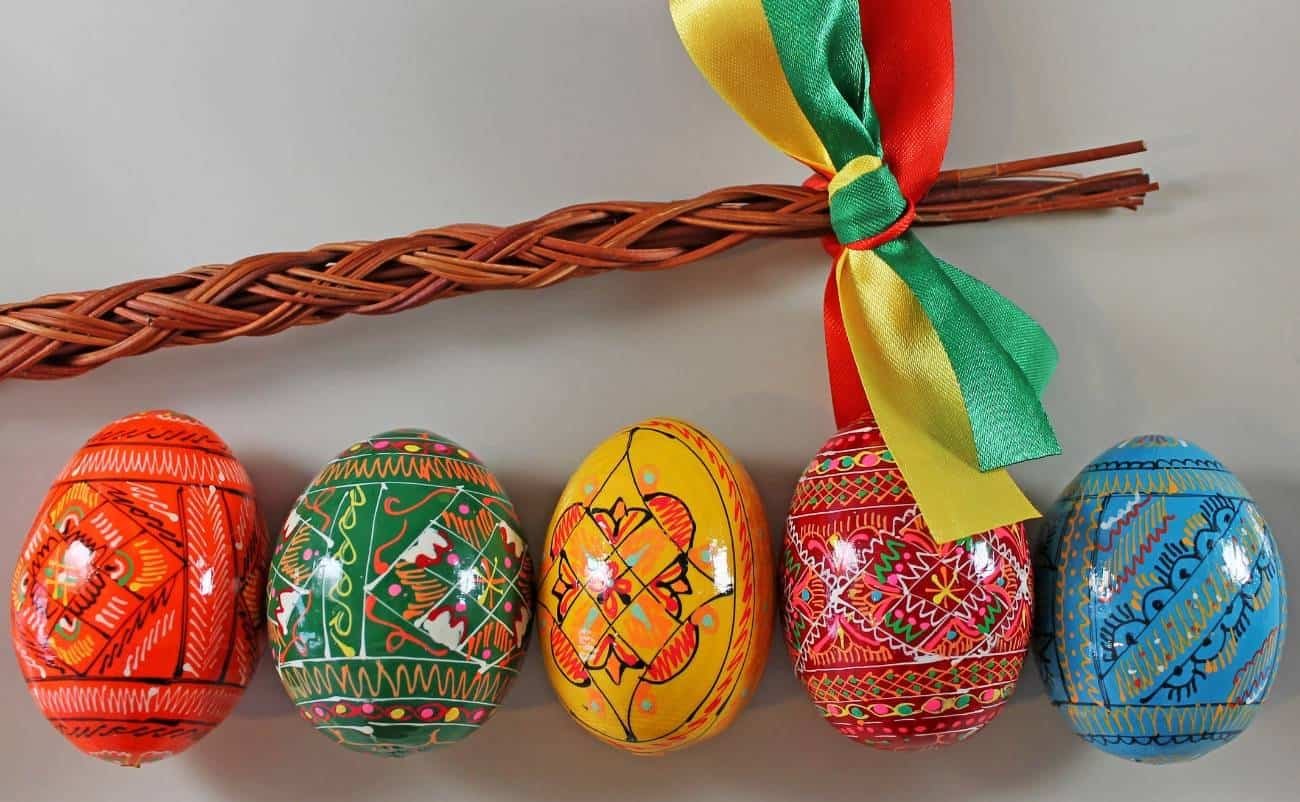 Colorful decorated Easter eggs connected with a ribbon, symbolizing celebration and joy. Perfect for Christian holiday imagery and Bible-themed content.