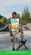 Beautiful young man at skatepark wearing a Bible-themed T-shirt promoting My Bible Song, blending faith and modern youth culture, perfect for inspiring Christian music and faith-based content.