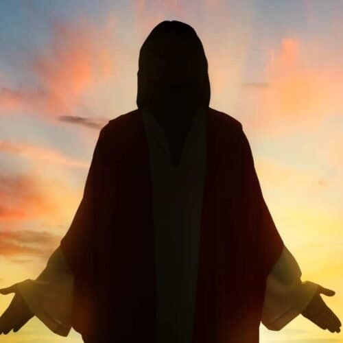 Silhouette of Jesus Christ with open arms during sunset, religious worship, spiritual worship, faith, Christian worship, divine, salvation, prayer, worship music, Jesus Christ, religious faith.