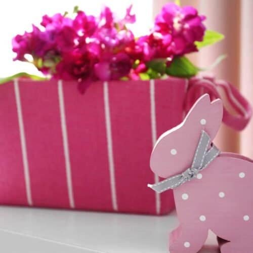 The Joy of Eastertide: Meaning of Eastertide, Celebrations, Traditions, and Meaningful Reflections My Bible Song 2025 Pink gift box with pink flowers and a cute pink wooden bunny, ideal for Easter or spring celebration, featuring bright colors and decorative details.