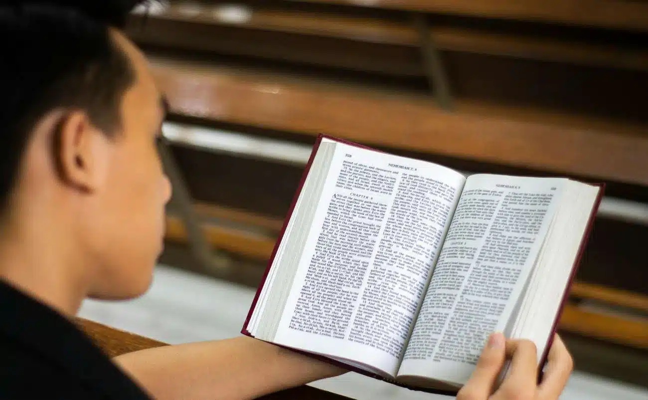 Bible reading, young person studying scripture, Christian faith, religious education, spiritual growth, Bible study session, faith development, church activity, devotional time, Bible verses, prayer, worship, Christian community, sacred scripture, worship service, Gospel, biblical teachings, religious life, spiritual reflection, Bible engagement, Christian worship, Bible quotes, personal faith journey, biblical learning, devotion, biblical study resources.