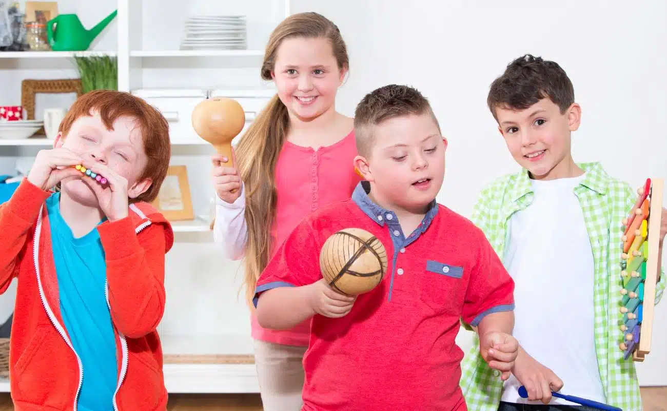 Children singing and playing musical instruments in a classroom, promoting children's faith and religious education through music.