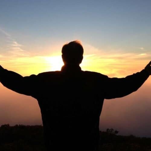 Unlocking Inner Peace: The Spiritual Benefits of Fasting You Need to Know My Bible Song 2025 Hopeful man raising arms at sunrise, spiritual worship, faith in God, prayer and praise, serenity and peace, religious devotion, silhouette of worshipper, spiritual connection, inspiration and gratitude.