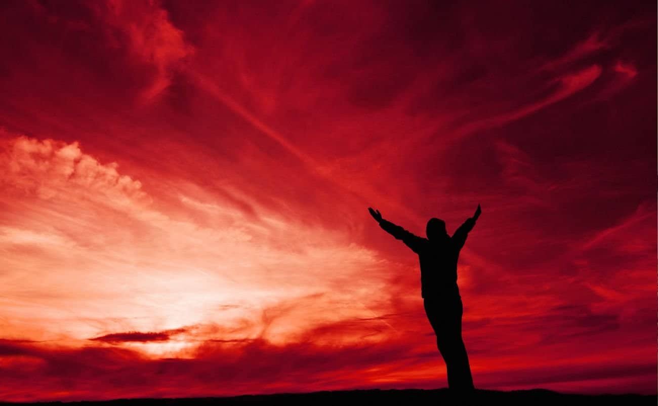 Hopeful Jesus silhouette prayer sunset sky worship faith spiritual reflection.