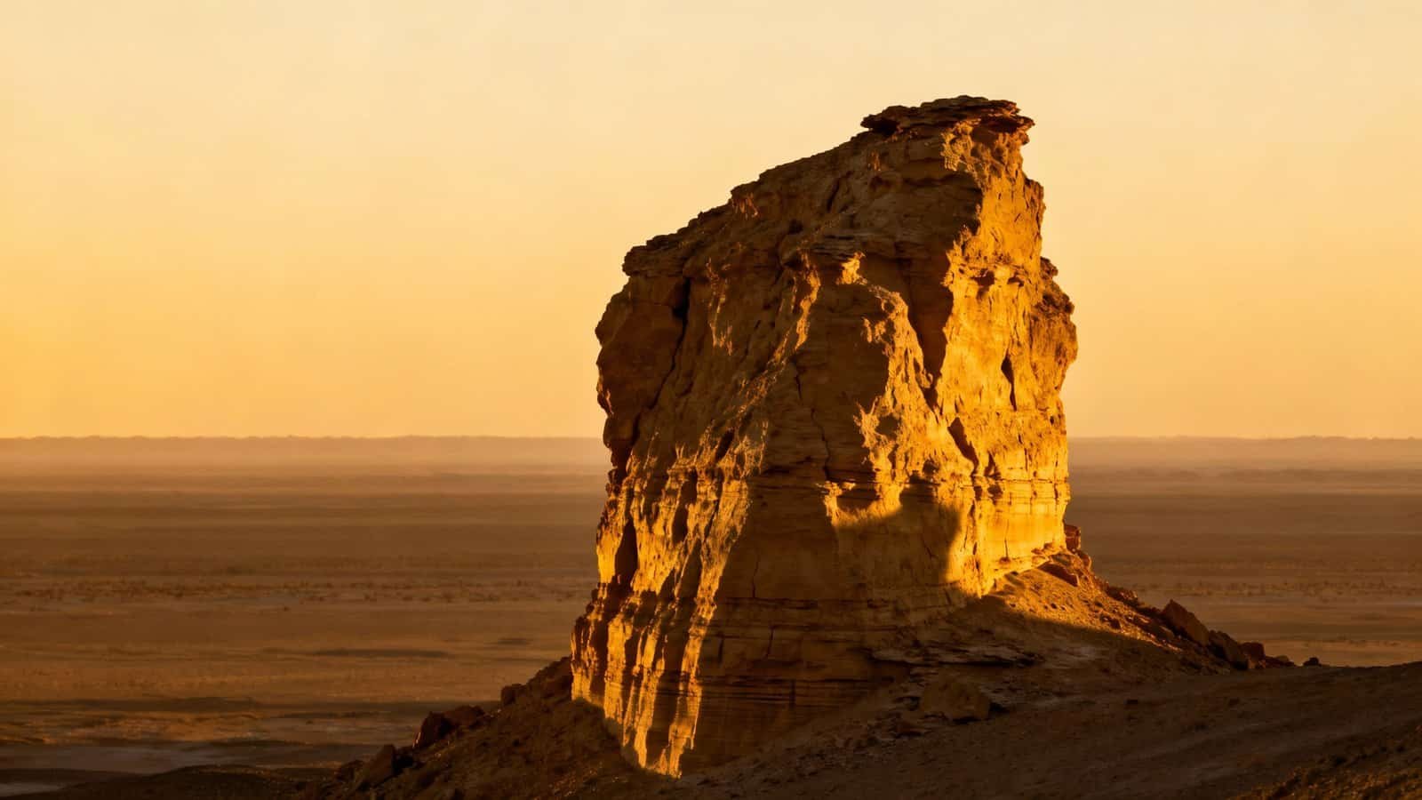 What Does the Bible Verse I Am That I Am Mean? My Bible Song 2026 Majestic desert rock formation illuminated by the setting sun, symbolizing faith and strength through biblical inspiration from My Bible Song. Perfect for religious and spiritual themes.