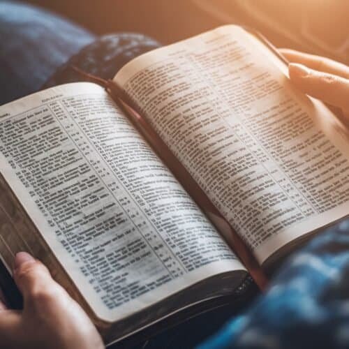 Finding Bible Verses for Strength in Difficult Times My Bible Song 2026 Bible open, person reading scripture, religious devotion, spiritual study, faith, prayer, Christian living, Bible study tools, worship, religious text, My Bible Song website imagery.