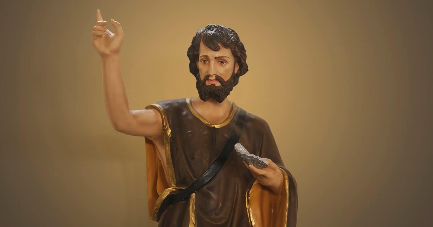 Jesus Christ statue with raised hand and Bible, religious worship figure, Christian faith symbol, spiritual leader, biblical inspiration, religious art, devotion, prayer, worship scene, faith expression, religious iconography, Christian church decor, spiritual guidance, biblical teachings, religious sculpture.