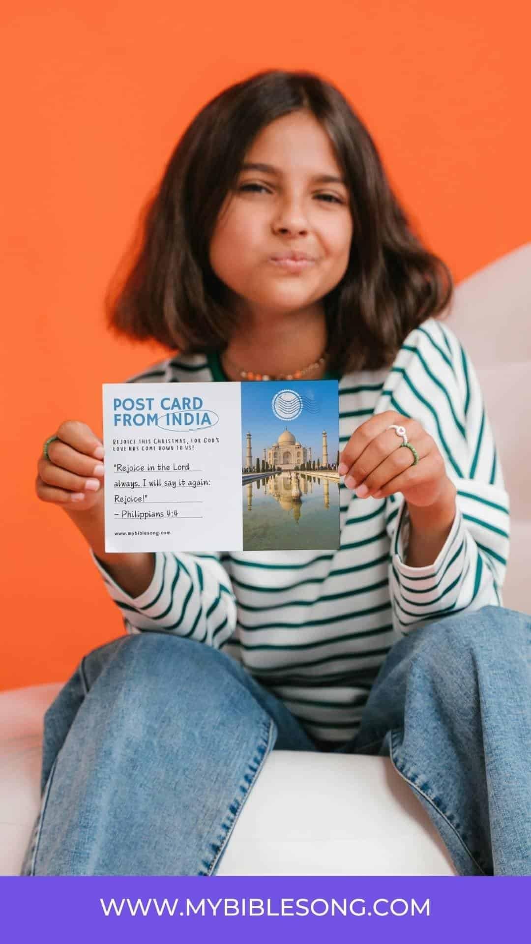 Colorful young woman holding a postcard with the Taj Mahal, promoting Christian music and Bible songs on MyBibleSong.com.