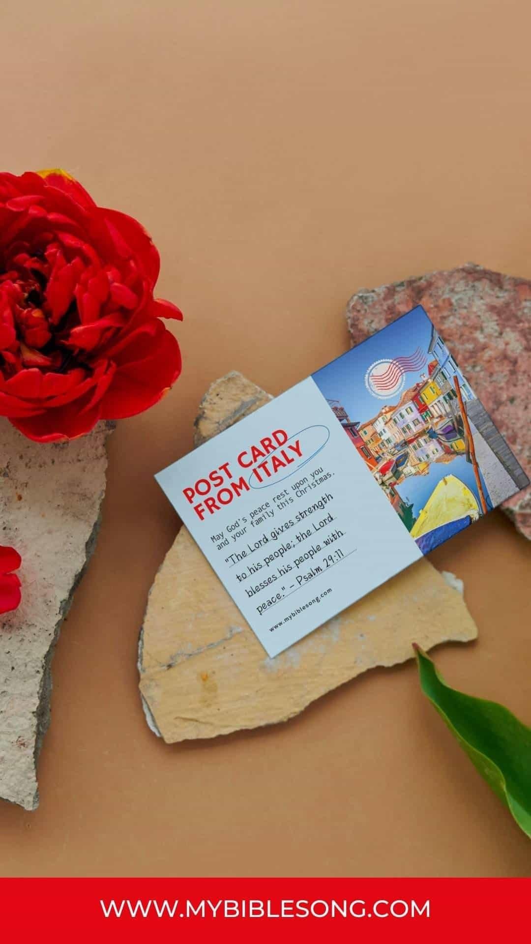 Postcard from Italy with Christian blessings and biblical quote, featuring a colorful Venice scene, red flower, and natural stone background for inspiration and faith.